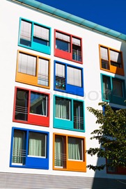 1558276-730277-a-house-in-the-city-with-colorful-windows-apartments-for-singles